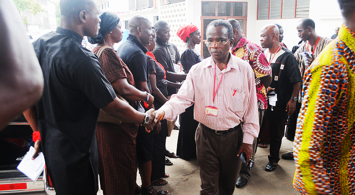 Mr Yaw Boadu-Ayeboafoh, Director, Newspapers, exchanging greetings with the bereaved family while other officials of the company follow in tow